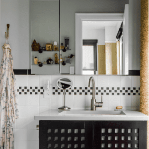 clean apartment bathroom with subway tiles and a mint green paint color