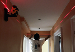 Using laser levels to mark for crown molding