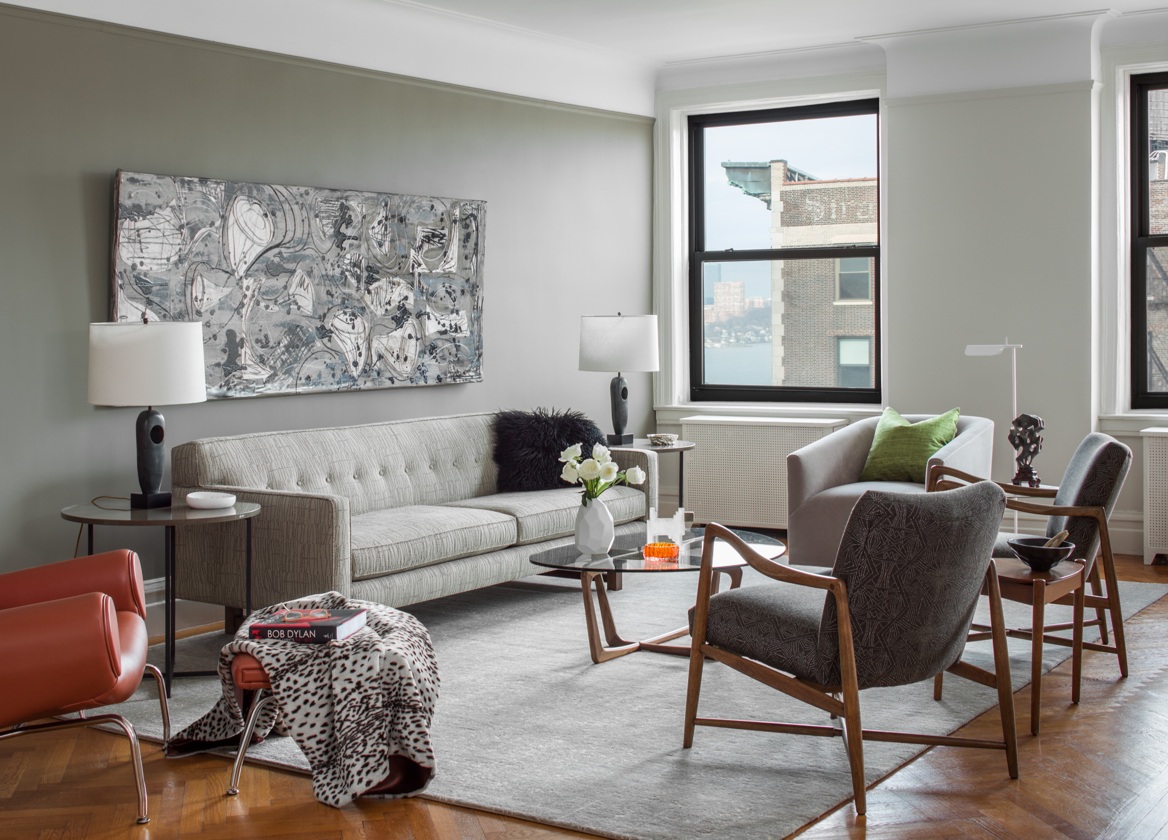 living room of a New York City apartment with clean modern furniture