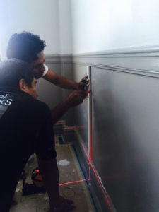 using a laser level to set lines on a wall
