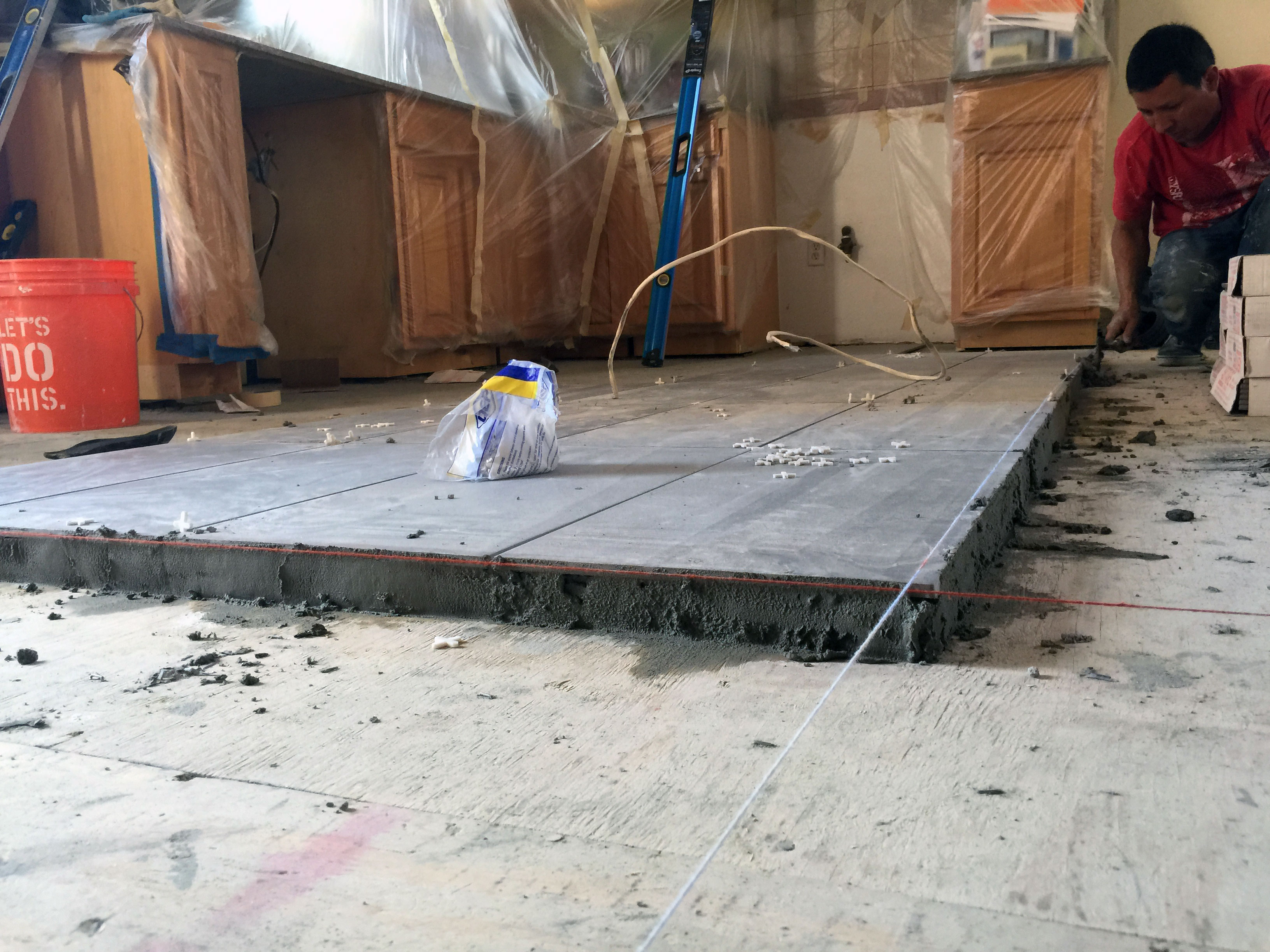 using chalk lines to layout a kitchen tile floor