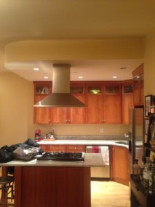 New York City apartment kitchen with central range hood