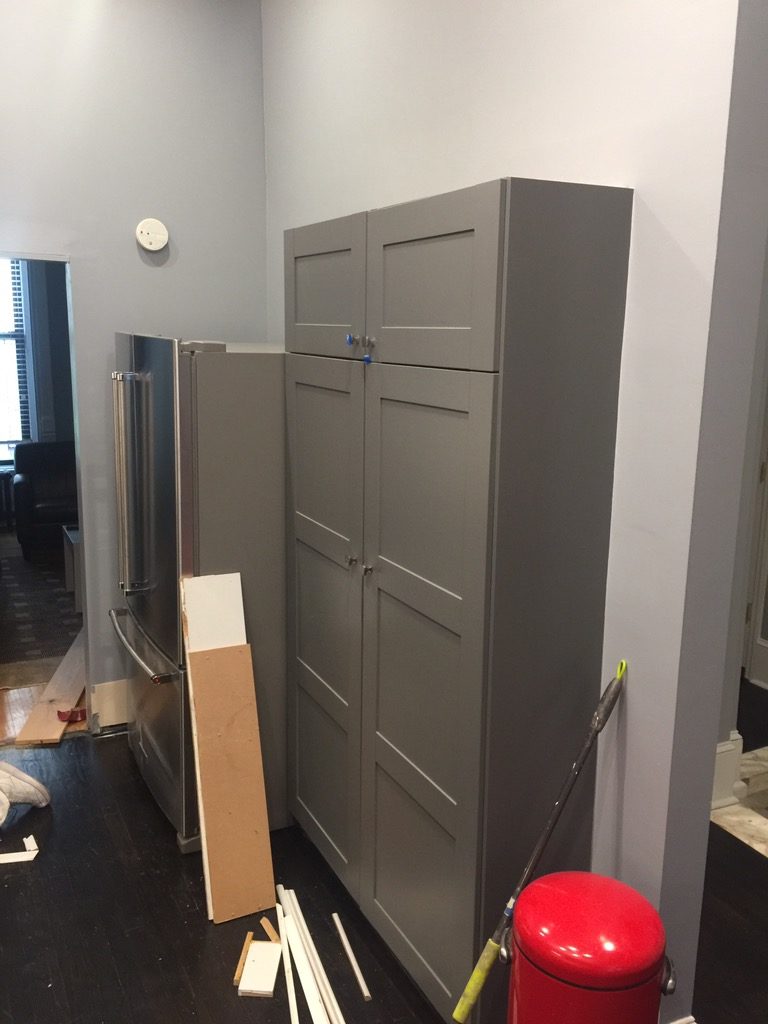 Freshly painted cabinets in a kitchen under construction