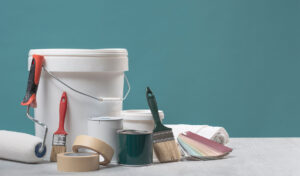 interior painting equipment including brushes, rollers, and masking tape