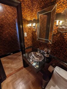leopard print wallpaper in a NYC apartment bathroom