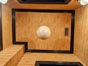 Looking up at a wallpapered ceiling