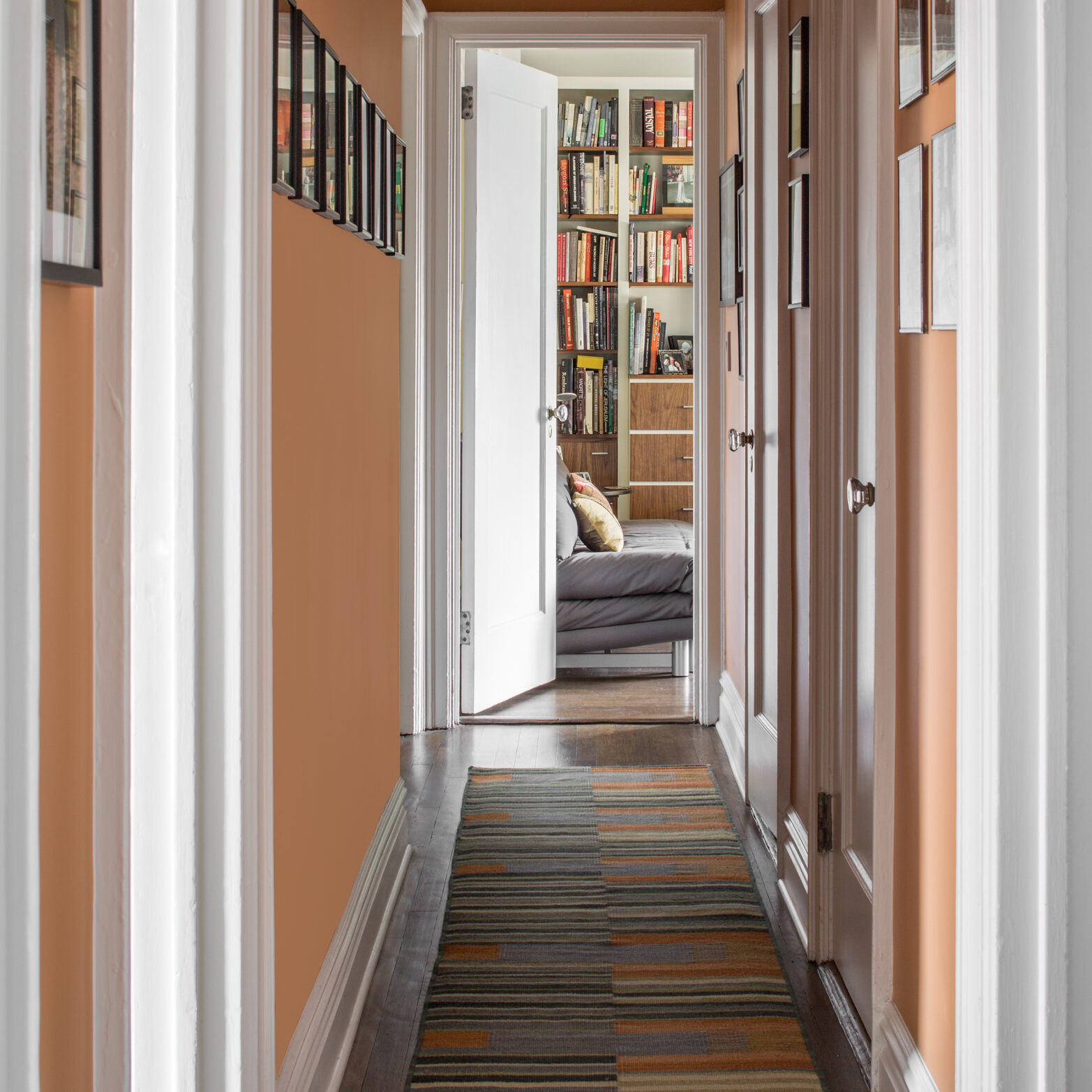 Hallway renovation with peach paint and restored trim