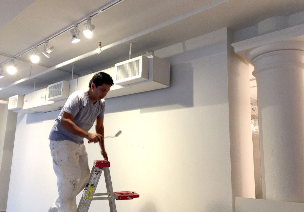 Commercial painter working on a retail space