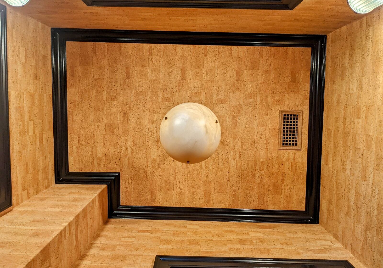 c79fde85-d0f0-4478-b9b6-9eb9f030f909 Looking up at a wallpapered ceiling