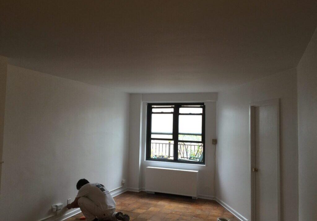Restored plaster ceiling and crown molding painted white